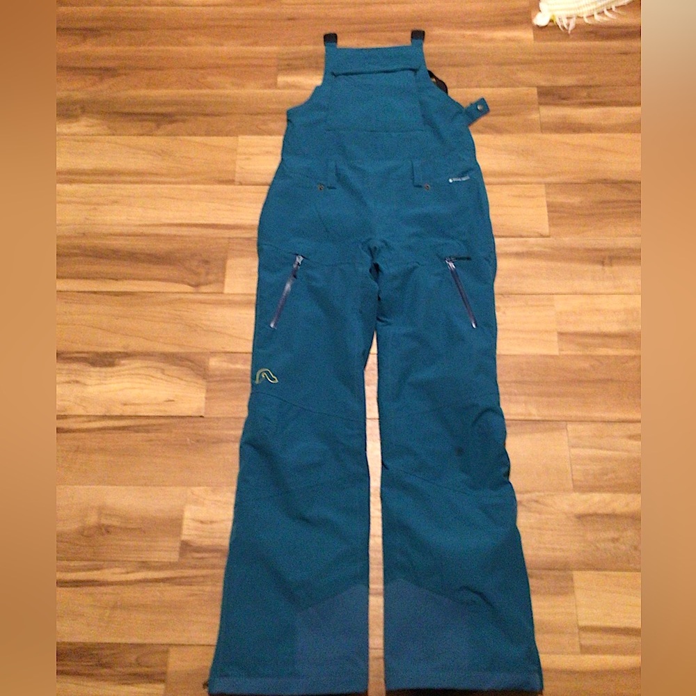 Flylow insulated bibs. Teal color size small.